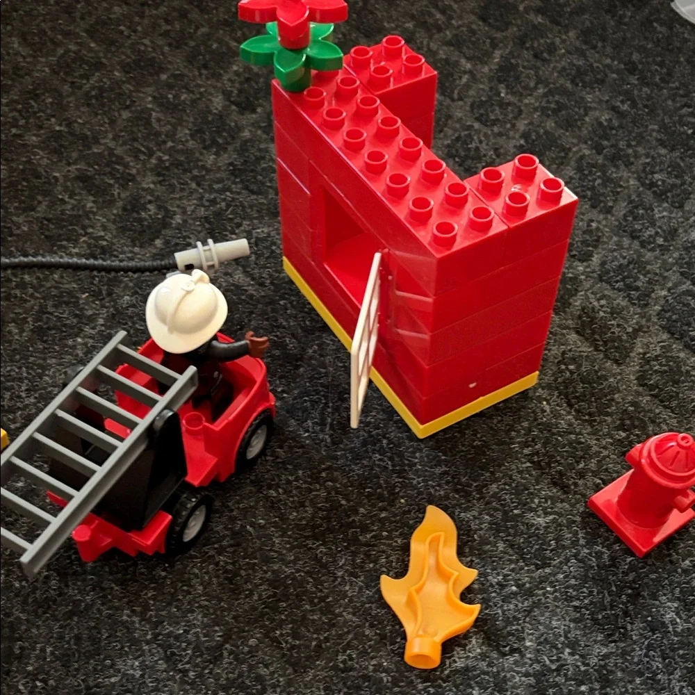 Lego Duplo Fire Truck With Firefighter Figure with fire hydrant and flame pieces